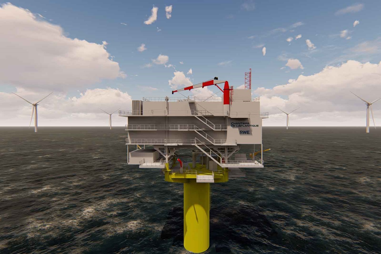 Platforma offshore z żółtą podstawą i kilkoma turbinami wiatrowymi w tle. Niebo jest pochmurne.